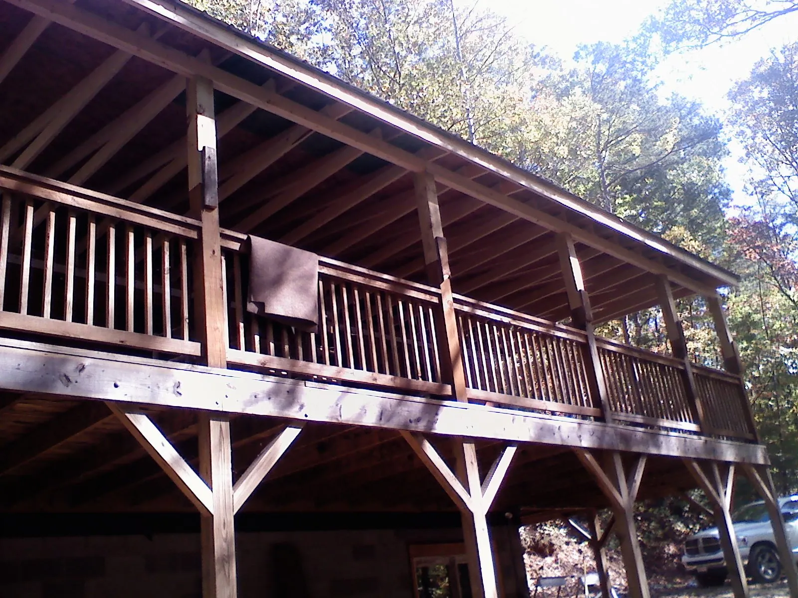 Timber framing under a new elevated porch and deck — Roof Leak Repair in Round O by Roofing Brothers